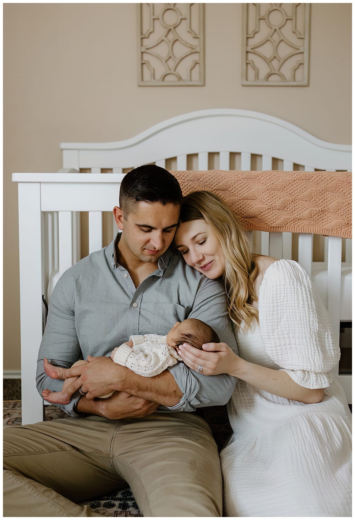 Parents smile at baby for In-Home Newborn Storytelling Session