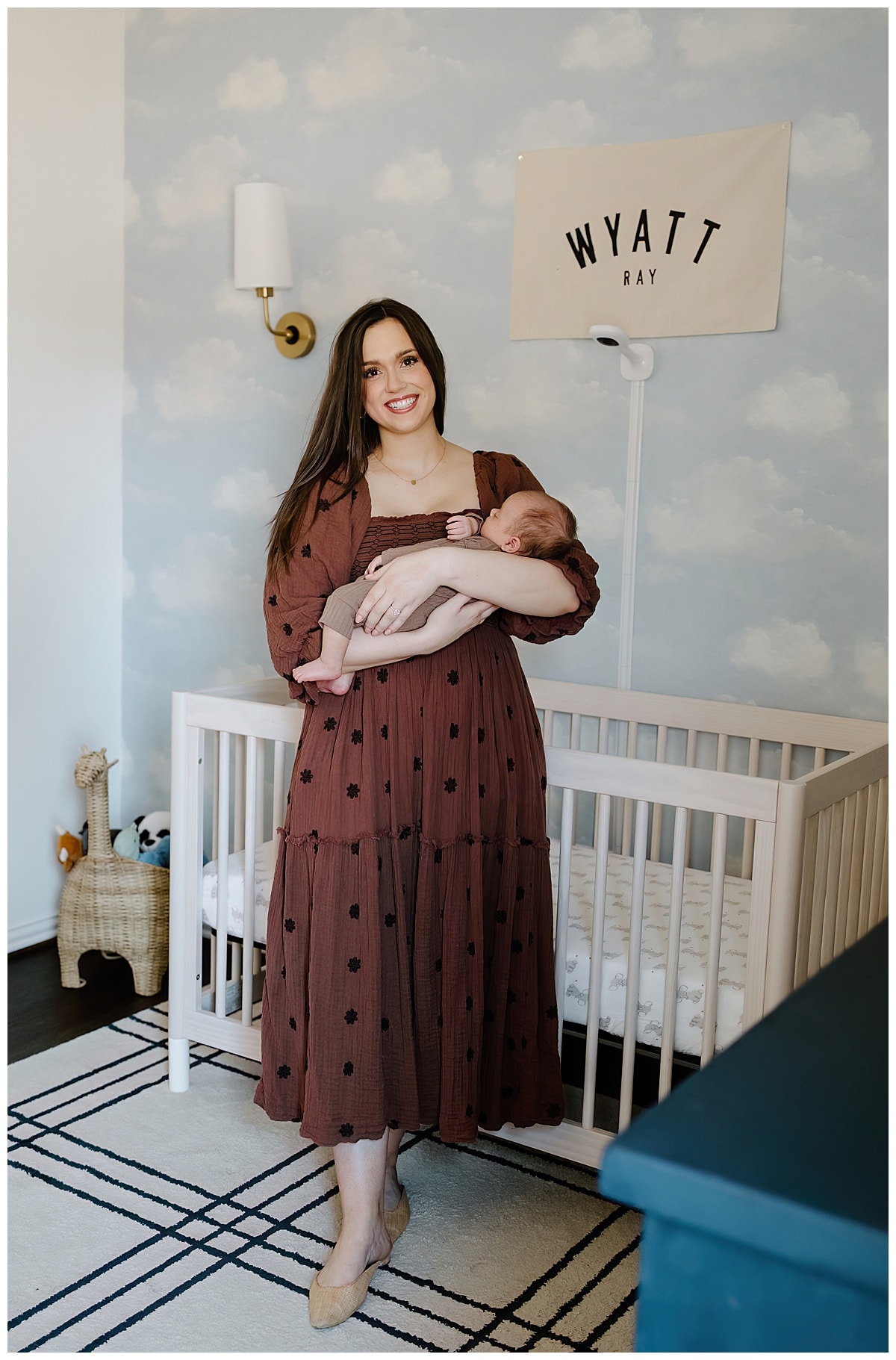 mom holds baby tightly and shares a big smile for Austin Newborn Photographer