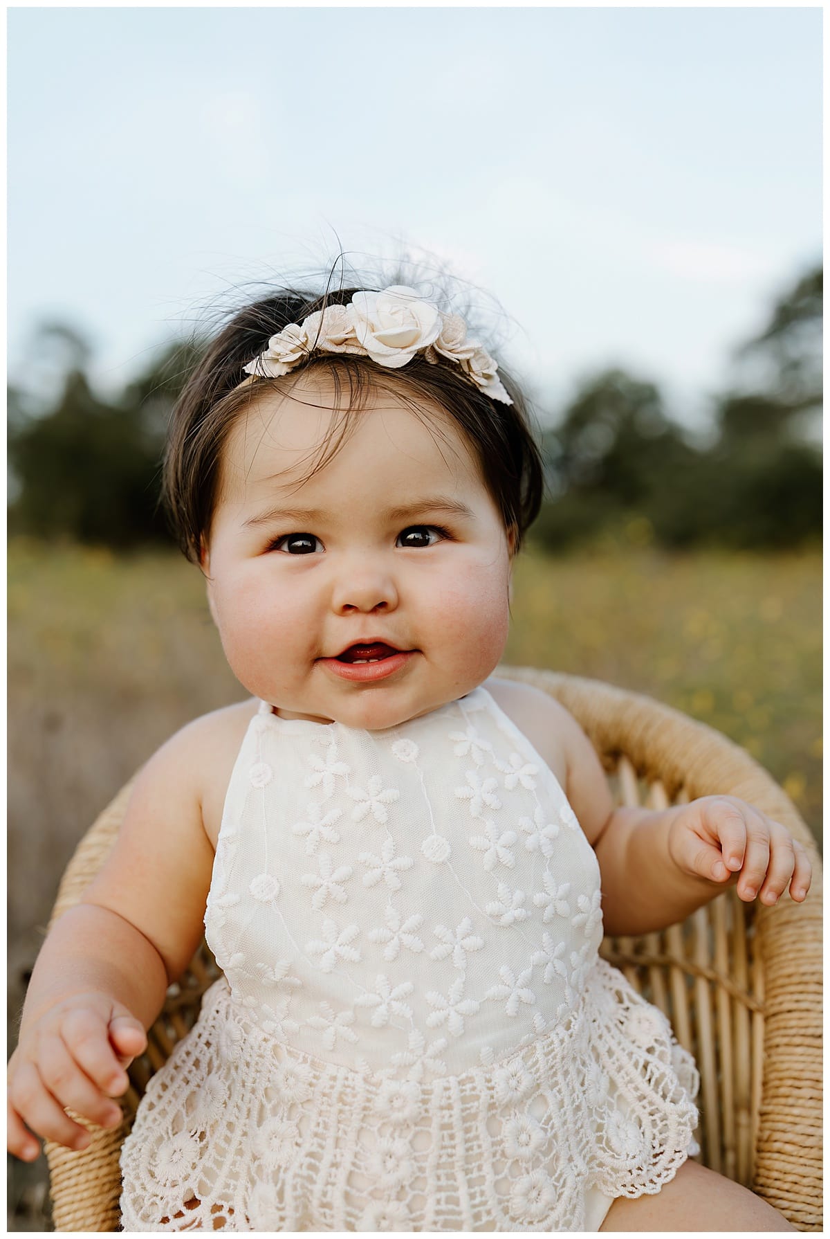 Baby girl smiles big for First Birthday Family Photos 