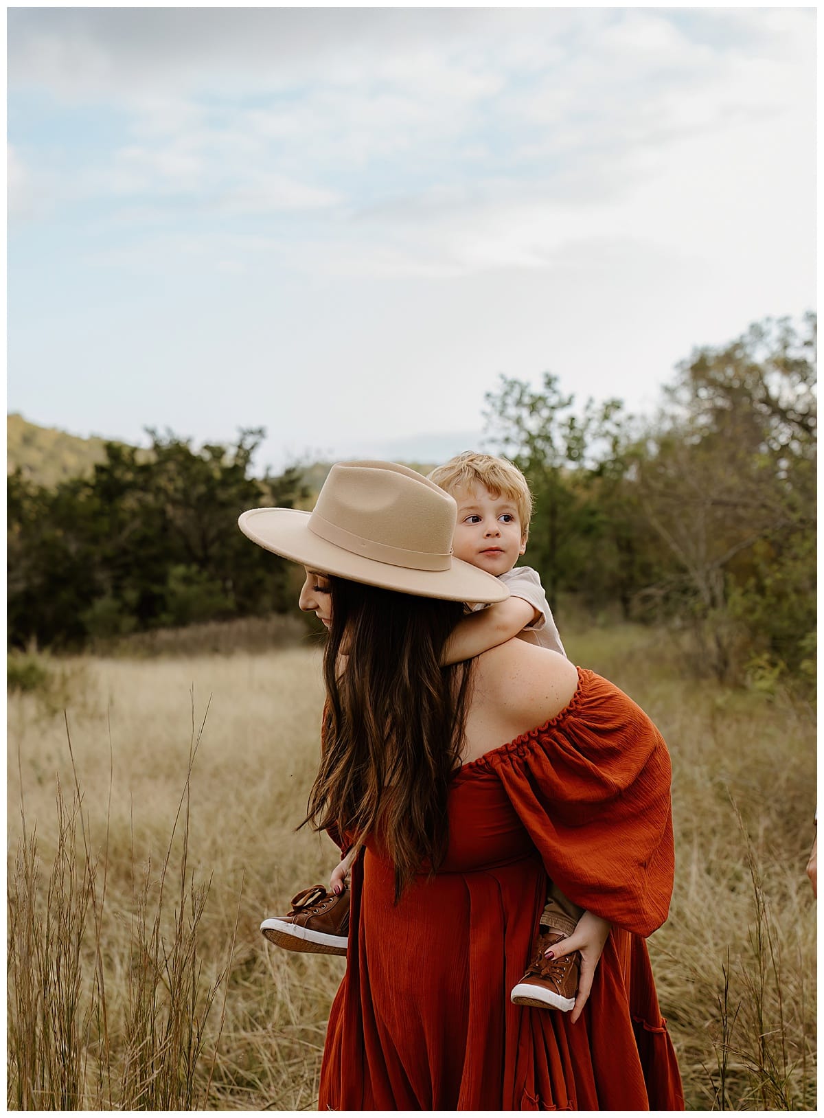 Son rides on moms back for Austin Motherhood Photographer