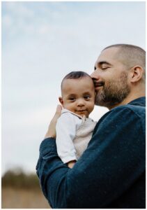 Dad shares a kiss with son for Our Adventuring Souls Photography