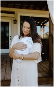 Mom holds baby on her chest for Our Adventuring Souls Photography