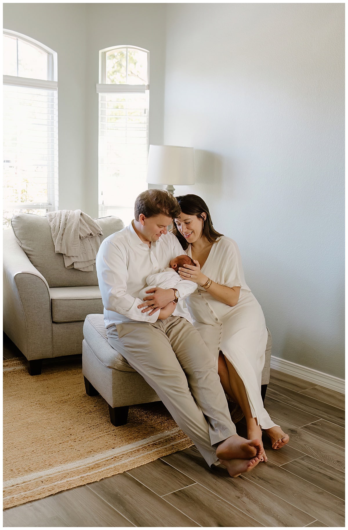 Mom and dad smile at newborn for Our Adventuring Souls Photography