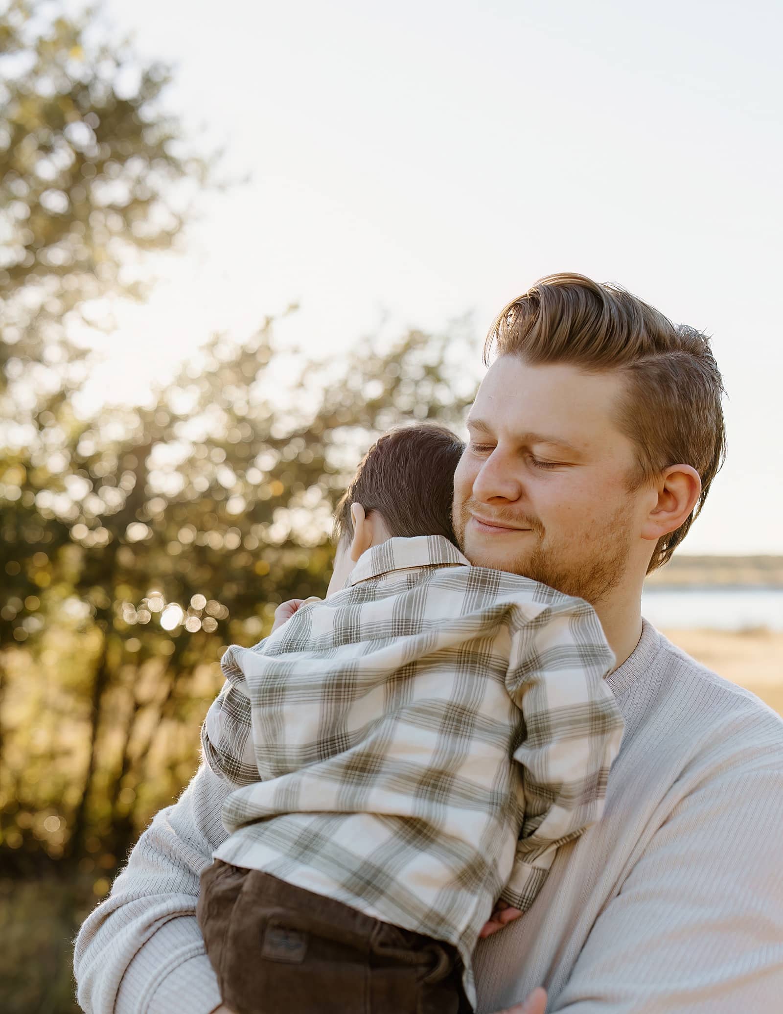 Dad holds young son for Austin Motherhood Photographer