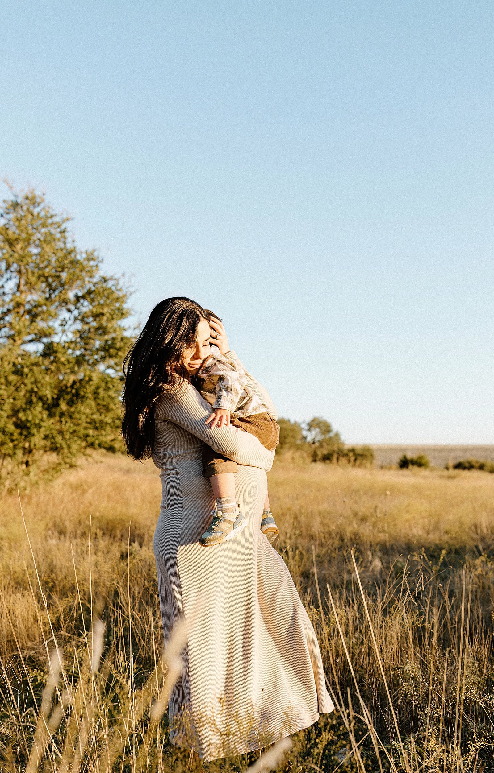 Mom holds young boy for Our Adventuring Souls Photography