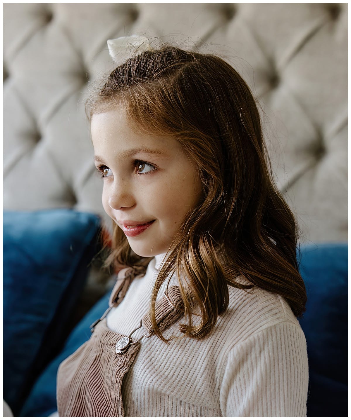 Young girl smiles during In-Home Documentary Family Photos