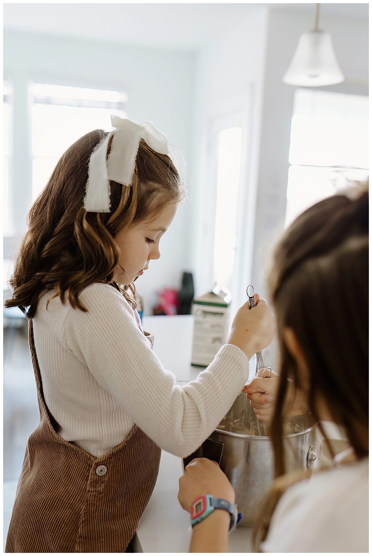 Young girl mixes baking mix for Austin Lifestyle Photographer