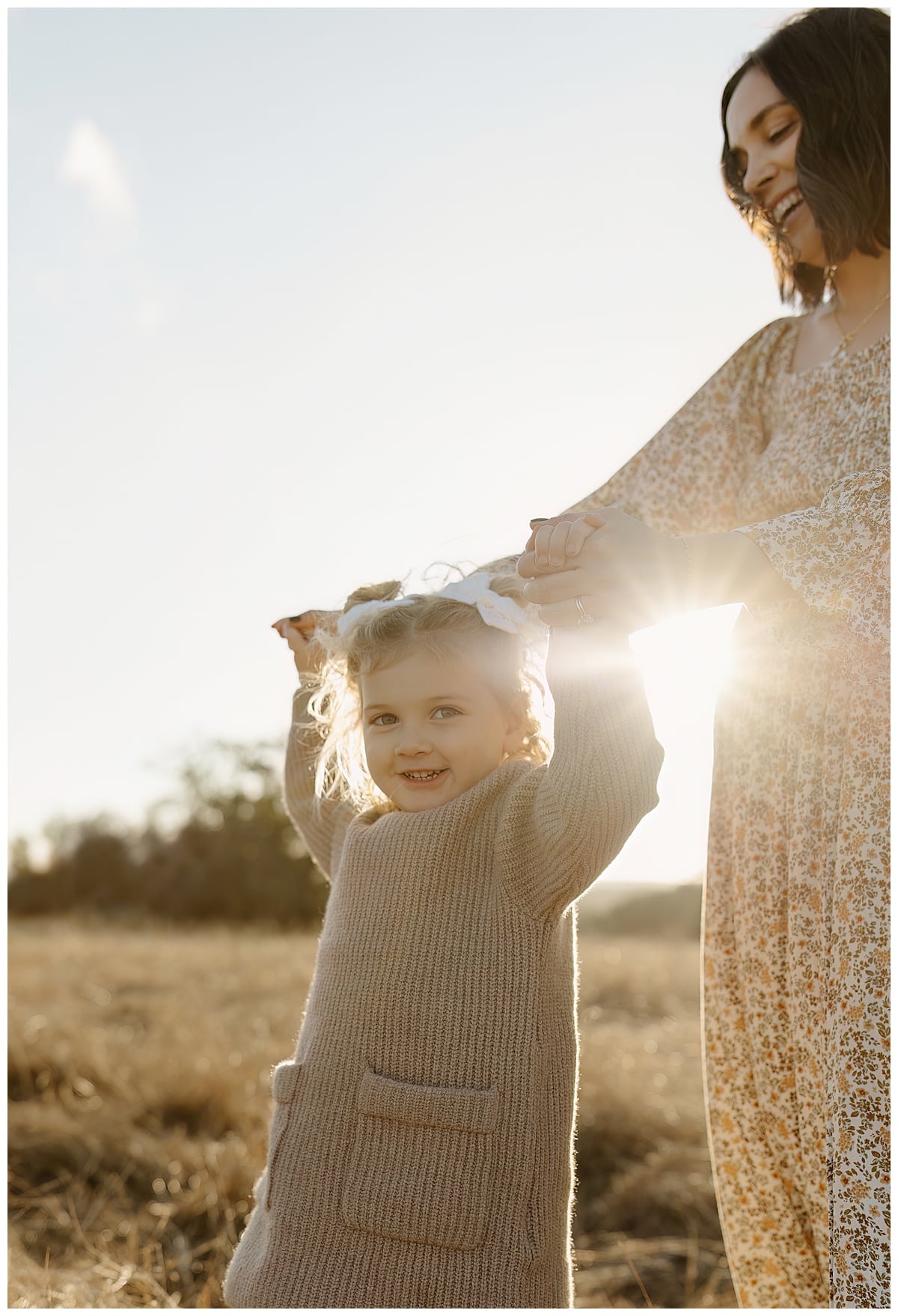 Young kid walks with mother during their Winter Family Photos