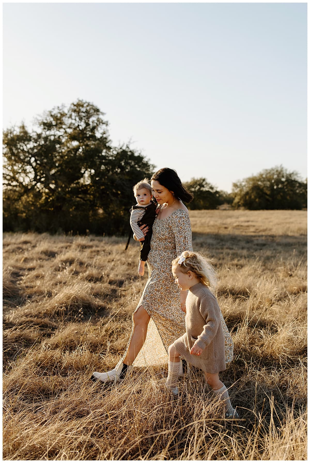 Mom walks with children during their Winter Family Photos