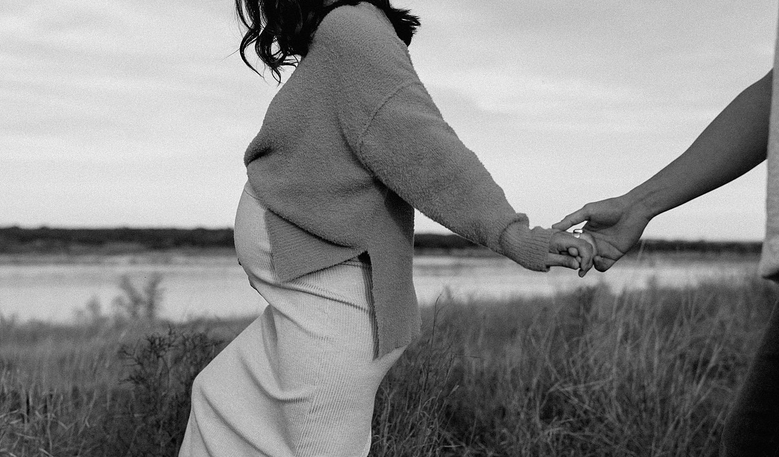 Couple holds hands and walk together for Our Adventuring Souls Photography